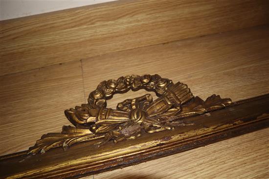 An Italian carved walnut panel, a giltwood frieze and a brass wall rack